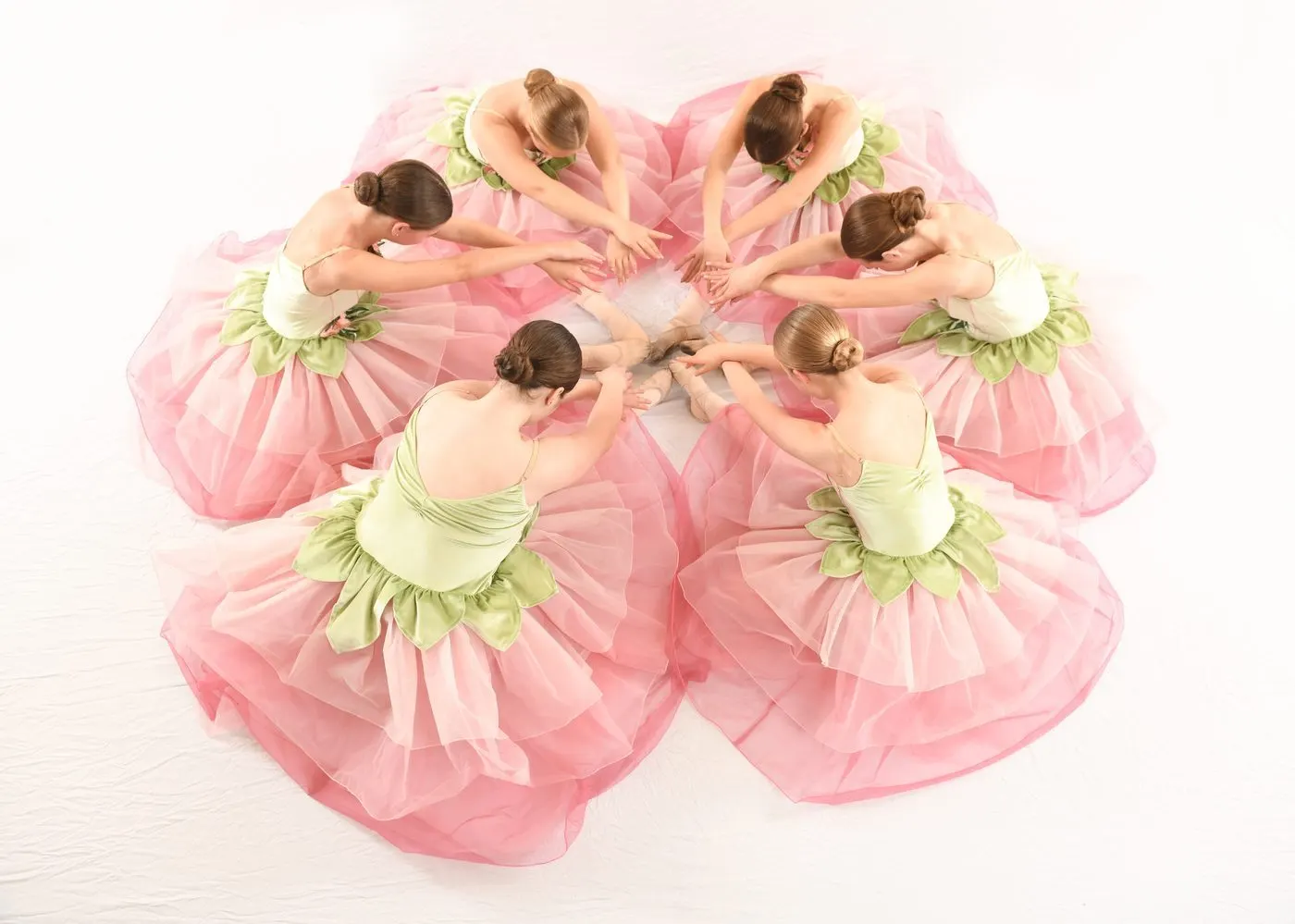 Ballet dancers in flower circle formation